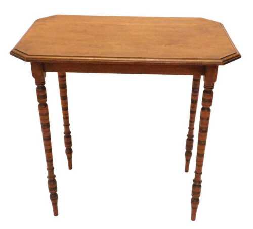 A very early 20thC oak occasional table, the canted top raised on turned legs, 77cm high, 73cm...