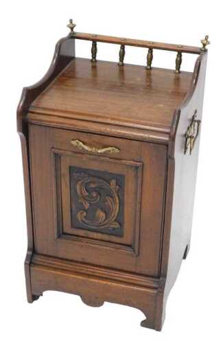 V - An early 20thC heavily carved oak coal purdonium, with a galleried top, side carrying handles...