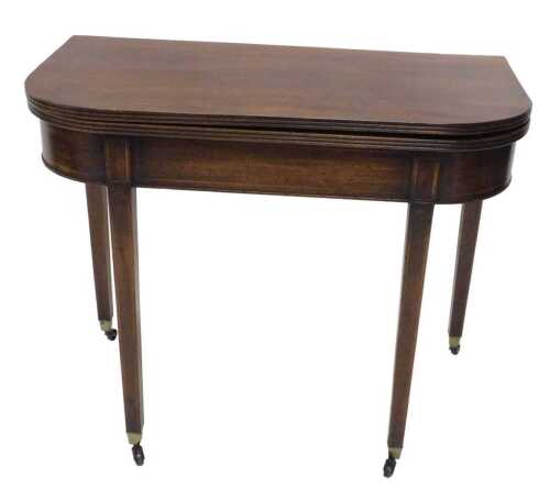 A 19thC mahogany D end fold over tea table, partially inlaid, on square tapering legs...