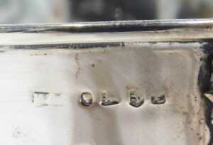 An early 20thC silver mug, of shaped bellied circular form, with leaf and bark handle, on... - 3