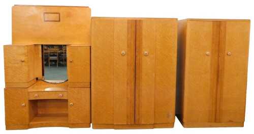 A mid 20thC bird's eye maple Epstein bedroom suite, comprising triple wardrobe, 185cm high,...
