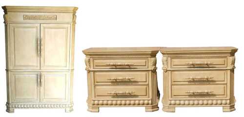 A French style heavily carved light oak bedroom suite, comprising press cupboard wardrobe and...