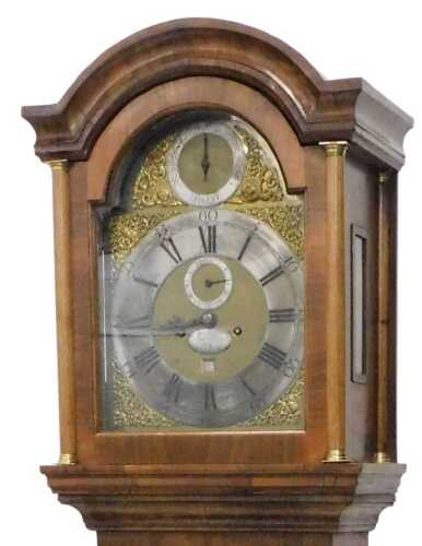 An 18thC brass faced longcase clock, the arched dial with a silvered 29cm diameter chapter ring,...
