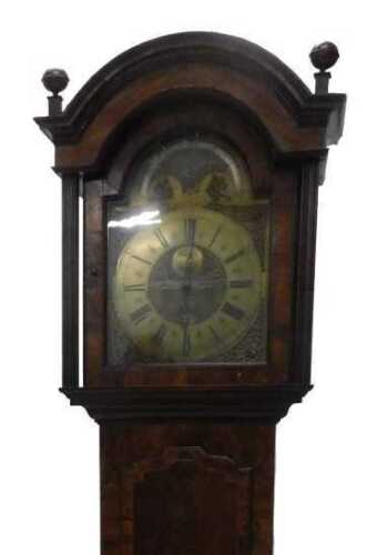 An early 19thC walnut longcase clock, with a part painted arched brass dial, with part moving...
