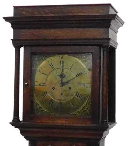 A 19thC oak cased longcase clock, the square hood revealing a 32cm wide brass dial, with Arabic...