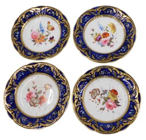 A set of four 19thC English porcelain dessert place, of shaped circular form, hand painted with...