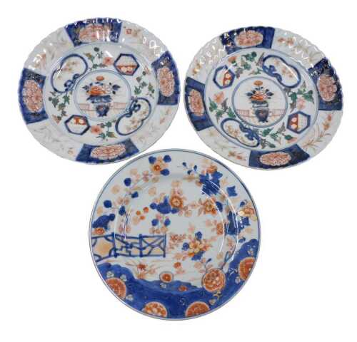 A pair of 19thC Japanese Meiji period Imari style plates, of floral form, centred with a hand...