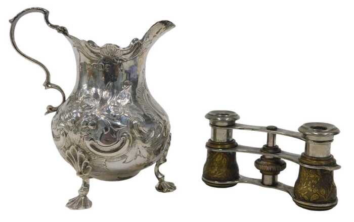 A Victorian silver cream jug, with flared rim, acanthus leaf ear handle, bulbous, repousse...