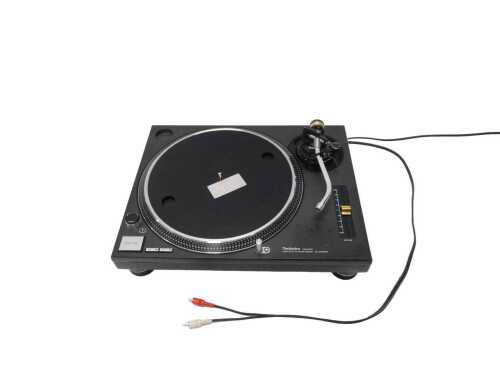 V - A Technics quartz direct drive turntable system, SL-1210MK2, in black finish, 46cm wide. 
Note:...