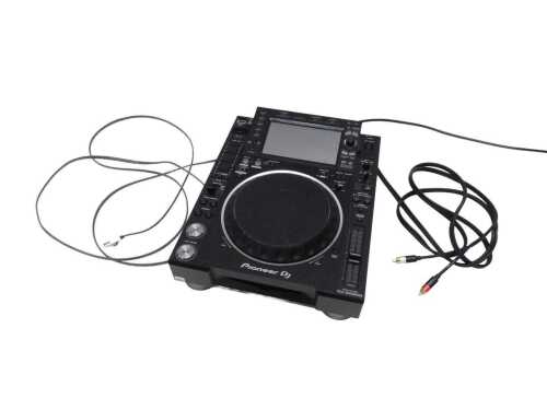 V - A Pioneer DJ multiplayer CDJ-2000 NXS2 professional digital multiplayer, featuring large jog...