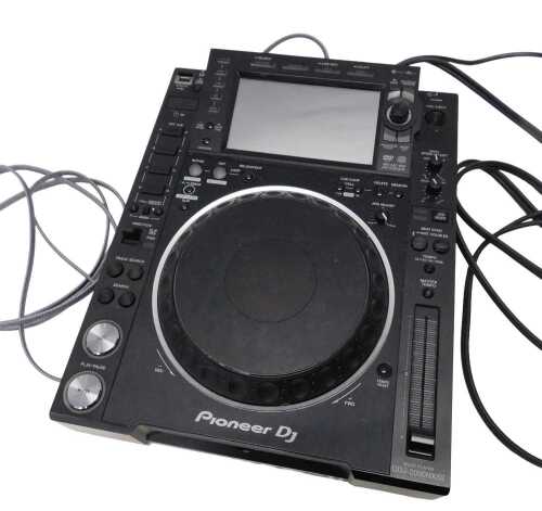 V - A Pioneer DJ multiplayer CDJ-2000 NXS2 professional digital multiplayer, featuring large jog...
