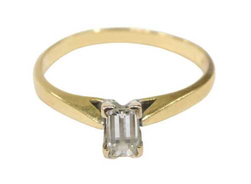 An 18ct gold diamond solitaire ring, set with baguette cut diamond, 5.2mm x 3.2mm x 2.8mm,...