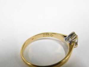 An 18ct gold diamond solitaire ring, set with baguette cut diamond, 5.2mm x 3.2mm x 2.8mm,... - 2