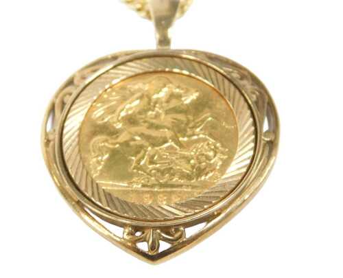 An Elizabeth II full gold sovereign pendant and chain, dated 1982, in 9ct gold heart shaped and...