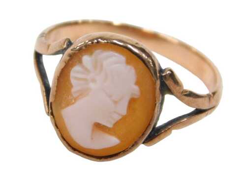 An early 20thC rose gold cameo dress ring, set with a cameo of maiden looking dexter, on V...
