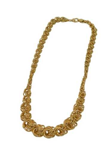 A swirl coil graduated necklace, with clip clasp, bearing import marks and stamped 9ct Bonded...