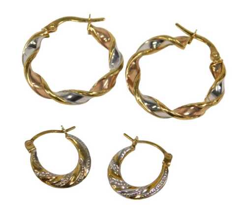 Two pairs of 9ct gold hoop earrings, comprising a pair of circular tricolour twist hoops, 2cm...