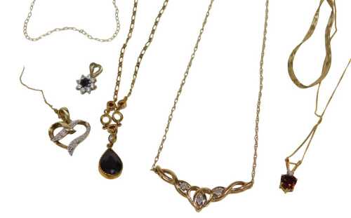 A group of scrap yellow metal and pendants, comprising part 9ct gold chains, four stone set...