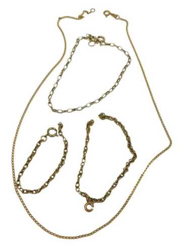Three 9ct gold chains, comprising a curb link bracelet, 20cm long, a fine link neck chain, 40cm...
