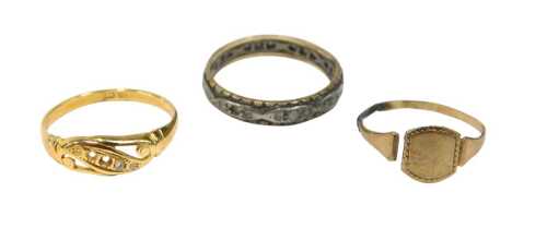Three dress rings, comprising a 9ct gold signet ring, cut, a 9ct gold and silver eternity ring...