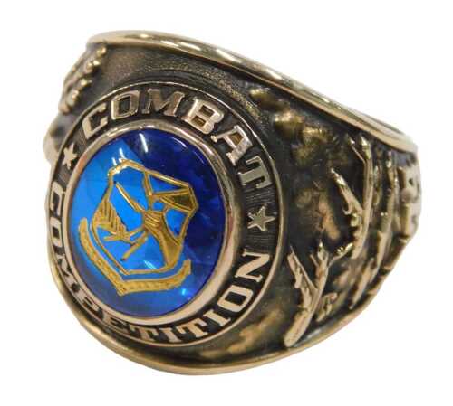 A Balfour Company Boeing Combat Competition gentleman's signet ring, with cabochon cut sapphire...