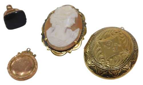 Four 19thC and later jewellery items, comprising a locket, with embossed floral basket design,...