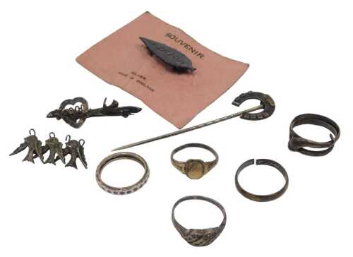 A group of silver jewellery, comprising five silver dress rings, a silver horseshoe stick pin,...