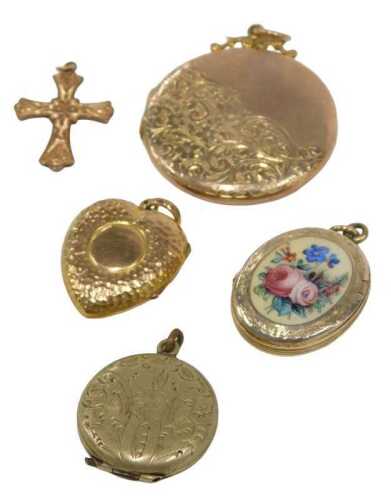 Four lockets and a crucifix pendant, comprising a yellow metal circular pendant with half scroll...