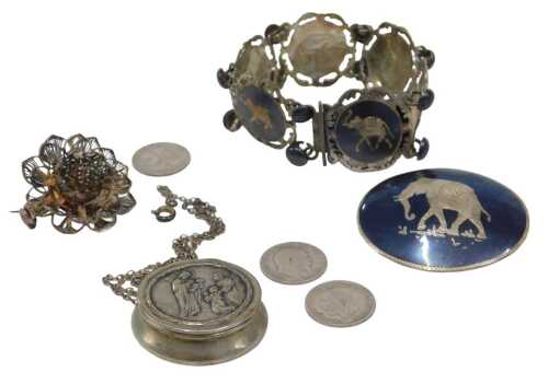 Four items of white metal jewellery, comprising a St Christopher locket, pendant and chain,...