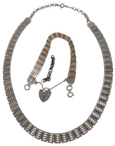 Silver jewellery, comprising a silver collerette necklace, and a silver charm bracelet, 43.7g,...