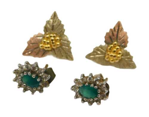 Two pairs of earrings, comprising a pair of bicolour grape vine leaf earrings, on single pin...