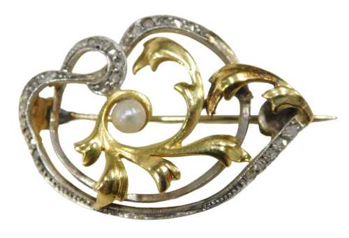 A late 19th/early 20thC brooch, bicolour design, the centre yellow gold swirl with a cultured...