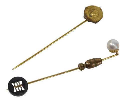 Two stick pins, comprising a cultured pearl pin, yellow metal stamped 10k, 7cm high, and a Fix...