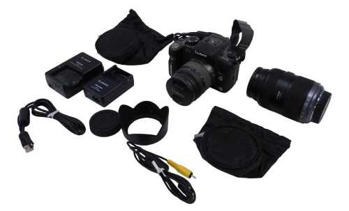 A Panasonic HFSO45200 Lumix camera, and a further Panasonic G1 camera, 15cm high, each boxed...