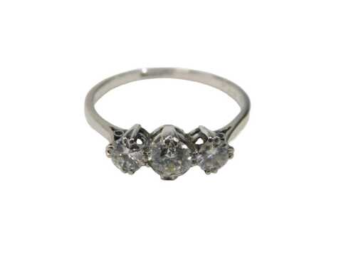 A three stone diamond dress ring, set with three round brilliant cut diamonds, the centre stone...