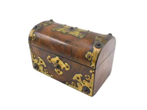 A 19thC walnut dome topped tea caddy, with elaborate metal mounts and escutcheon, with key, 15cm...