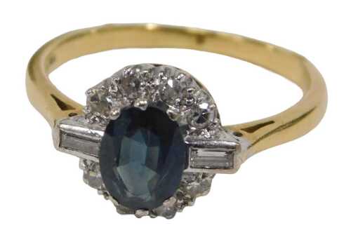 A sapphire and diamond Art Deco style dress ring, the central oval cut sapphire, 6.2mm x 5.2mm x...