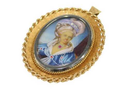 A mid 20thC 18ct gold framed portrait brooch, depicting a female quarter-profile gem set and...