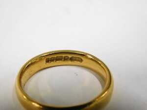 A 22ct gold wedding band, of plain design, 4mm width, maker P&W, Birmingham 1899, ring size L&frac12;,... - 2