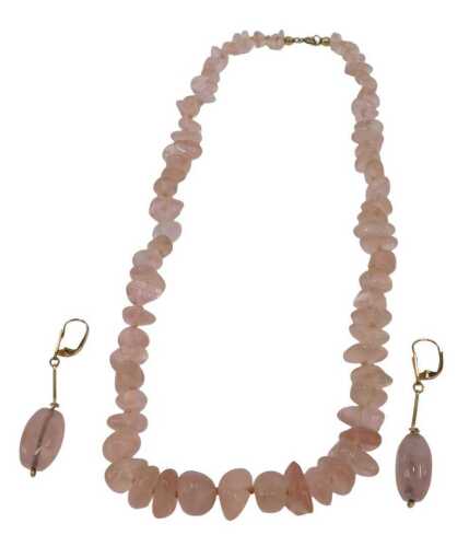 A rose quartz necklace, with graduated rough cut rose quartz, on a knotted pink string strand,...