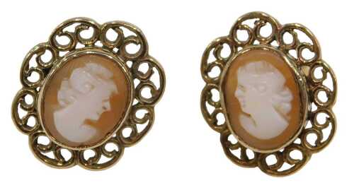 A pair of 9ct gold shell cameo stud earrings, each centred with an oval cameo, surrounded by a...