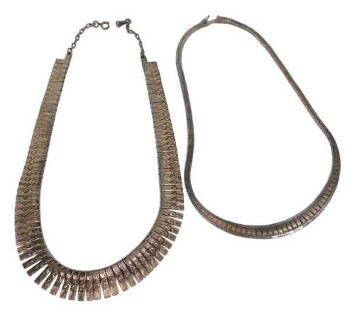 Two white metal necklaces, comprising a brushed Eastern inspired brickette necklace, 36cm long,...