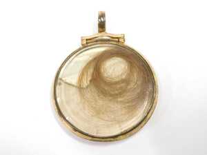 A 19thC memorial pendant, painted on ivory with a female figure in blue and yellow robes, with... - 2