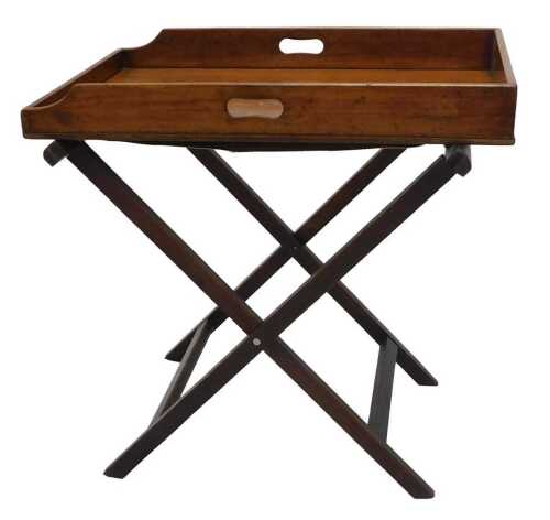 A 19thC mahogany two handled butlers tray, with a folding stand, 75cm high, 14cm wide, 49cm deep.