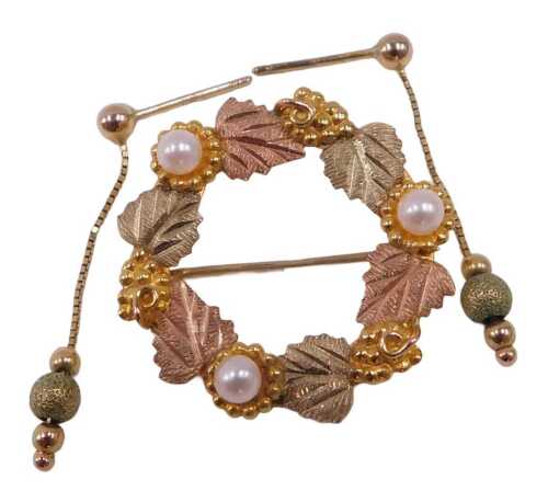 A brooch and pair of earrings, comprising a circular leaf and seed pearl bi-colour brooch,...