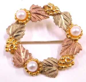 A brooch and pair of earrings, comprising a circular leaf and seed pearl bi-colour brooch,... - 3