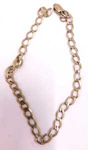 Two chains, comprising a flattened curb bracelet, 18cm long, yellow metal, unmarked and a part... - 2