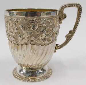 A Victorian silver mug, the heavily chased and repousse decorated bell shaped body, with shaped... - 2
