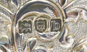 A Victorian silver mug, the heavily chased and repousse decorated bell shaped body, with shaped... - 4