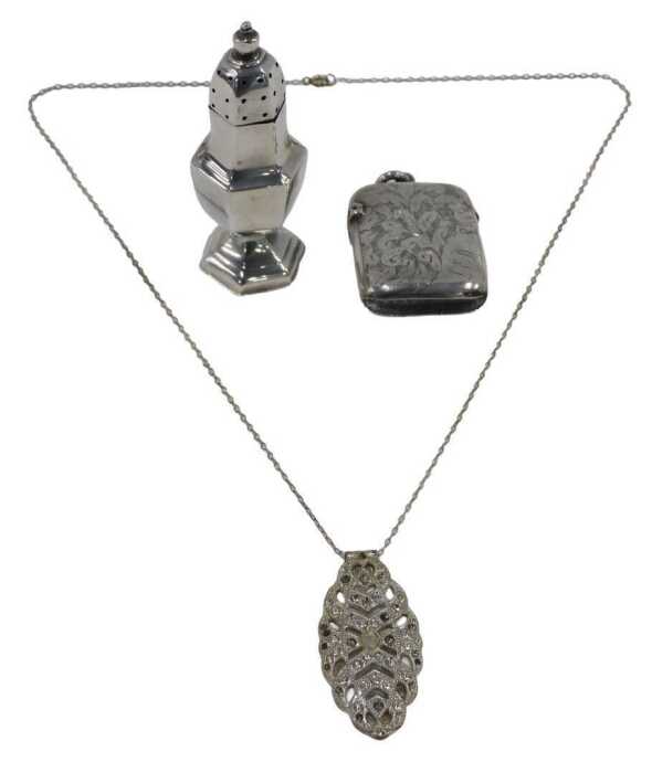A Victorian silver vesta case, of oblong form, with plain ring top and hinged lid, chased with...